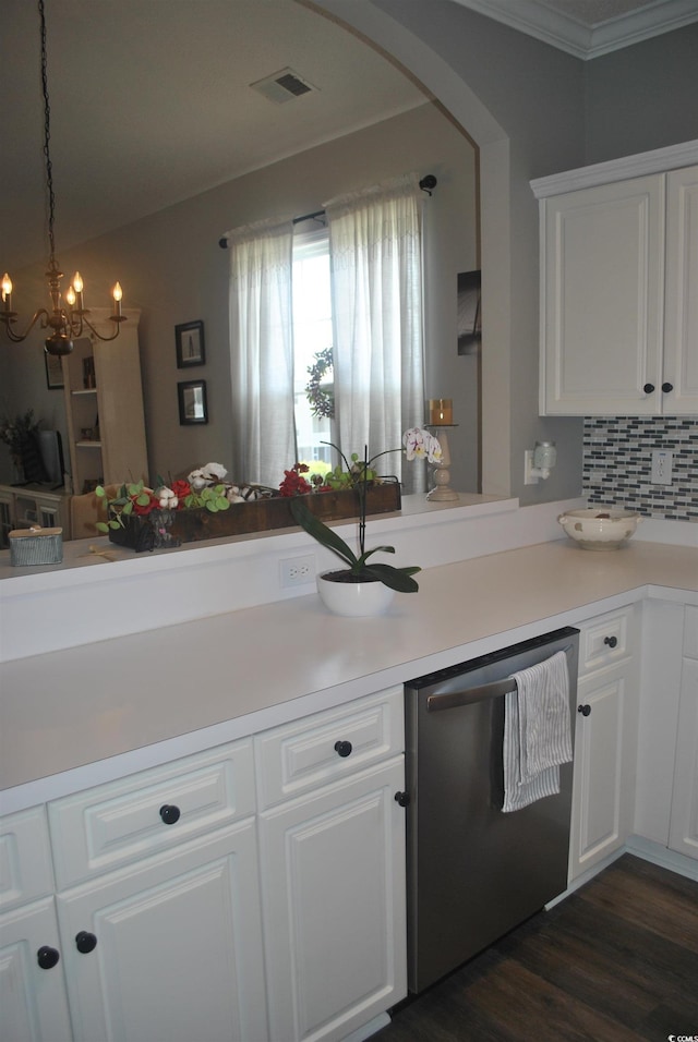 kitchen featuring dishwasher, arched walkways, white cabinetry, a chandelier, and crown molding