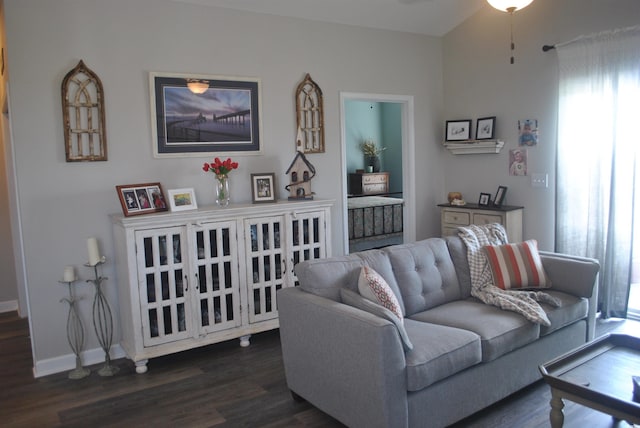 living room with dark wood-style flooring and baseboards