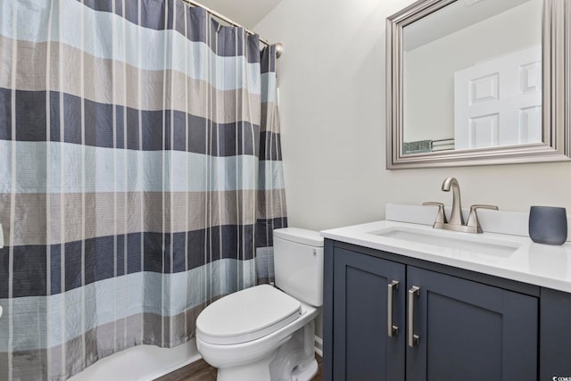 full bathroom with vanity and toilet