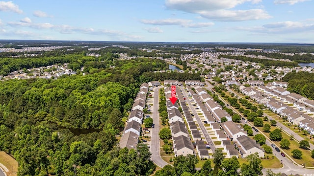 birds eye view of property featuring a water view and a residential view