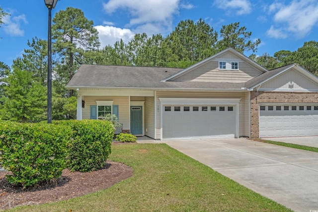 view of front of property with a garage, concrete driveway, brick siding, a front lawn, and a shingled roof