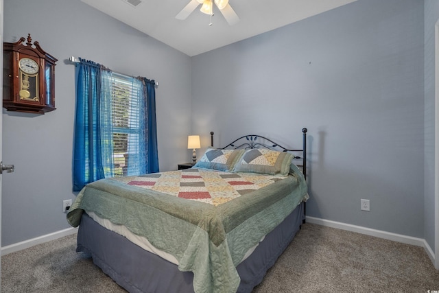 carpeted bedroom with baseboards and ceiling fan