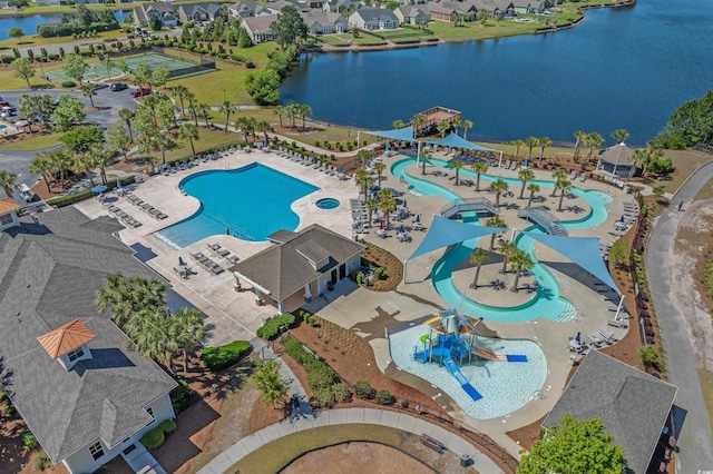 aerial view of a pool and a nearby body of water