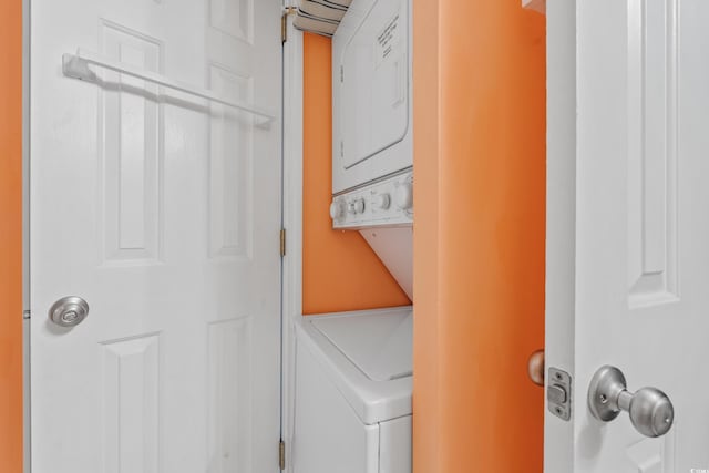 washroom with laundry area and stacked washer and dryer