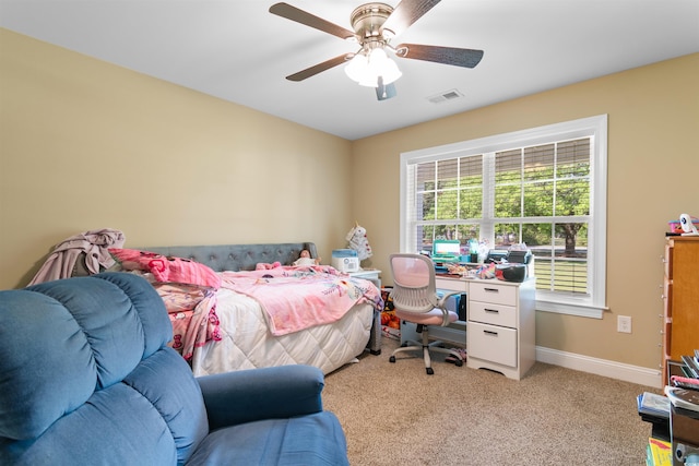 bedroom featuring light colored carpet, baseboards, ceiling fan, and visible vents