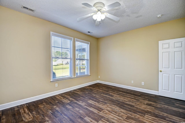 6172 Catalina Dr Unit 214, North Myrtle Beach, SC 29582 - empty room with dark wood-style flooring, baseboards, a ceiling fan, and a textured ceiling