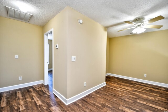 6172 Catalina Dr Unit 214, North Myrtle Beach, SC 29582 - spare room with a textured ceiling, dark wood finished floors, ceiling fan, a smoke detector, and baseboards