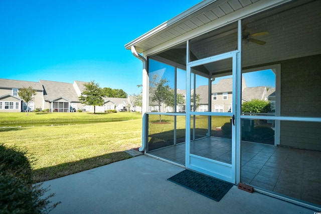 6172 Catalina Dr Unit 214, North Myrtle Beach, SC 29582 - view of patio with a sunroom, a ceiling fan, and a residential view
