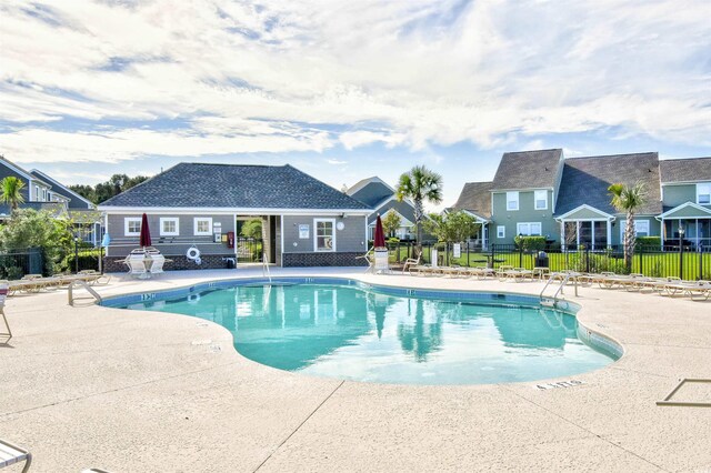 6172 Catalina Dr Unit 214, North Myrtle Beach, SC 29582 - community pool featuring a patio and a residential view