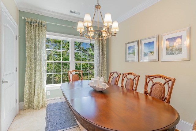 dining space with visible vents, baseboards, ornamental molding, and a notable chandelier