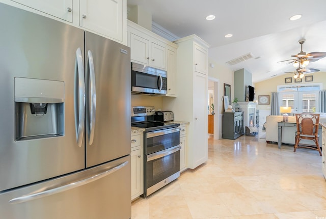 kitchen with appliances with stainless steel finishes, a ceiling fan, lofted ceiling, recessed lighting, and open floor plan