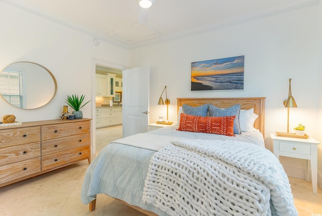 bedroom featuring crown molding and attic access