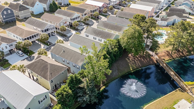 aerial perspective of suburban area featuring a large body of water
