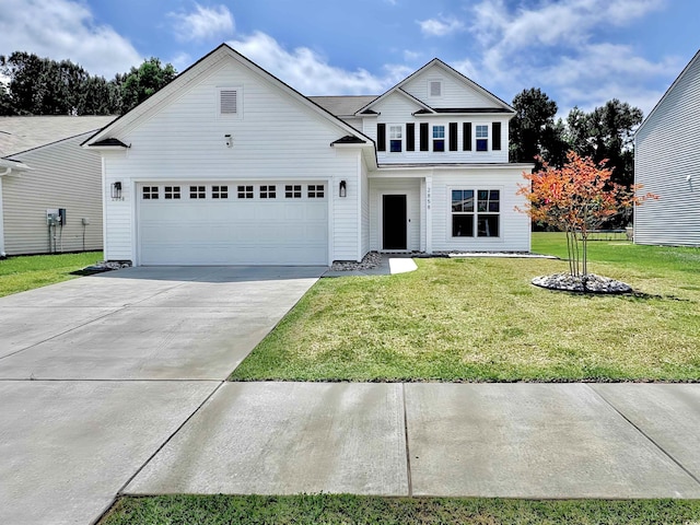 traditional home with concrete driveway, a front yard, and an attached garage