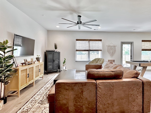 game room with light wood-style floors, pool table, and baseboards