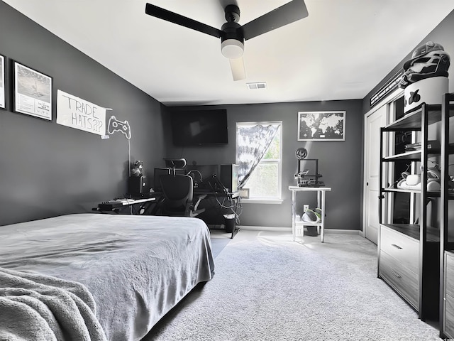 bedroom featuring carpet, an office area, and a chandelier