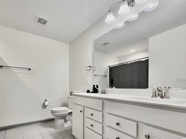 bathroom with tile patterned flooring, baseboards, and shower / bath combo with shower curtain