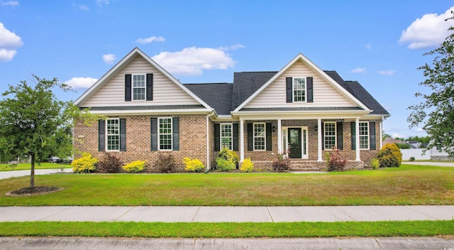 4067 Ridgewood Dr, Conway, SC 29526 - craftsman-style house featuring brick siding, a front lawn, and a porch