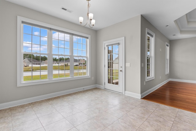 4067 Ridgewood Dr, Conway, SC 29526 - unfurnished dining area with healthy amount of natural light, tile patterned flooring, a chandelier, and baseboards