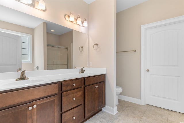 4067 Ridgewood Dr, Conway, SC 29526 - bathroom with a stall shower, double vanity, tile patterned flooring, toilet, and baseboards