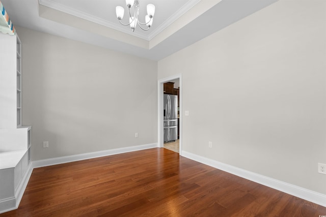 4067 Ridgewood Dr, Conway, SC 29526 - unfurnished room featuring a chandelier, wood finished floors, crown molding, a tray ceiling, and baseboards