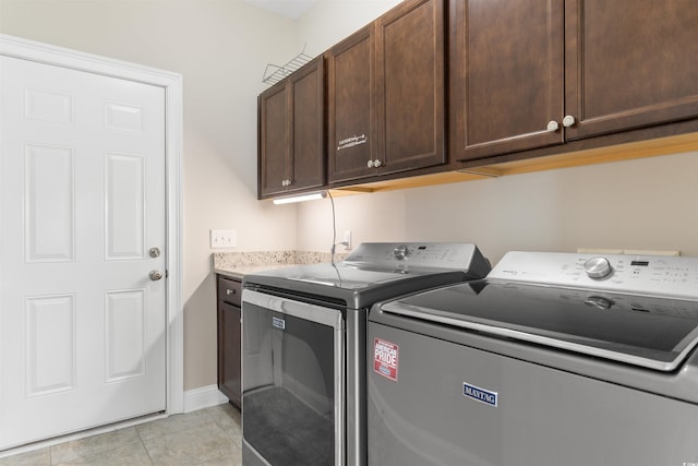 4067 Ridgewood Dr, Conway, SC 29526 - washroom with washer and clothes dryer, cabinet space, light tile patterned floors, and baseboards