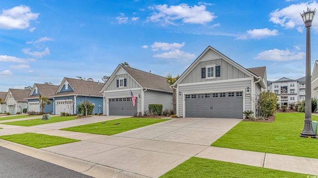 craftsman inspired home featuring concrete driveway, a front yard, a residential view, and board and batten siding