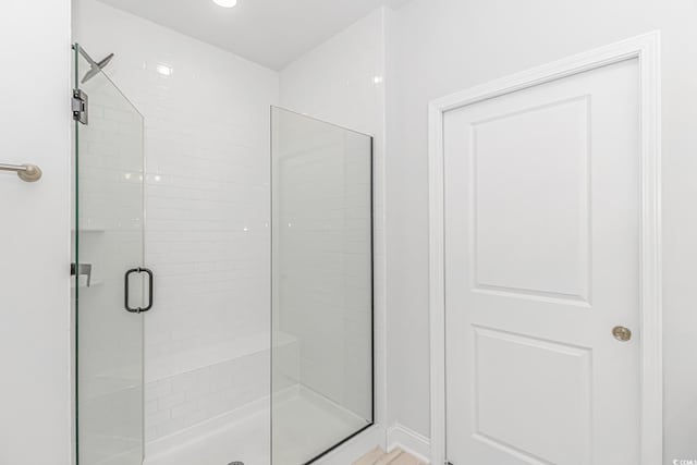 bathroom featuring a shower stall
