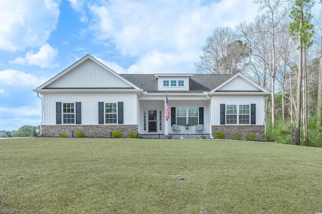 250 Ole Maple St, Loris, SC 29569 - view of front of property featuring a front yard, covered porch, brick siding, and roof with shingles