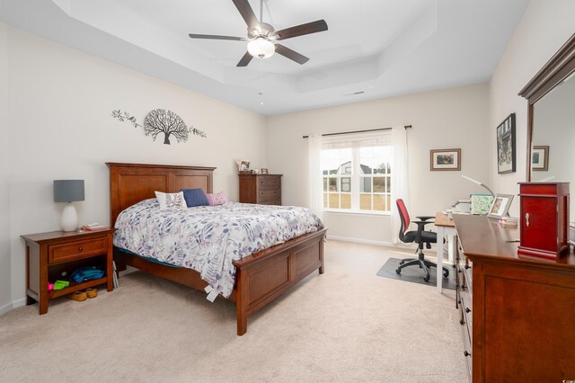 250 Ole Maple St, Loris, SC 29569 - bedroom featuring a tray ceiling, light carpet, a desk, baseboards, and a ceiling fan