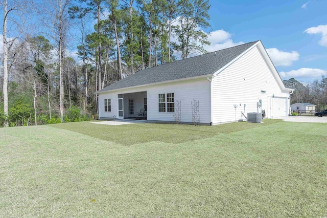 250 Ole Maple St, Loris, SC 29569 - rear view of property with a yard, concrete driveway, a shingled roof, and a patio