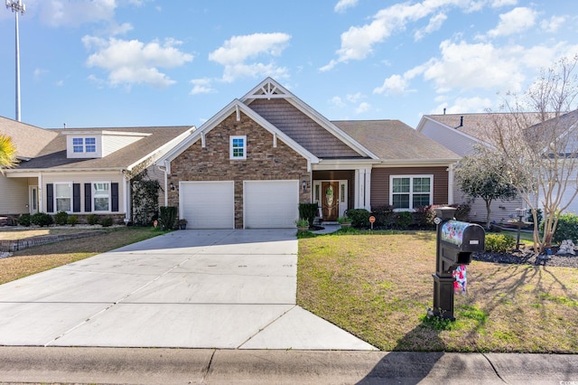 3672 White Wing Cir, Myrtle Beach, SC 29579 - view of front of house featuring driveway, a front yard, and stone siding