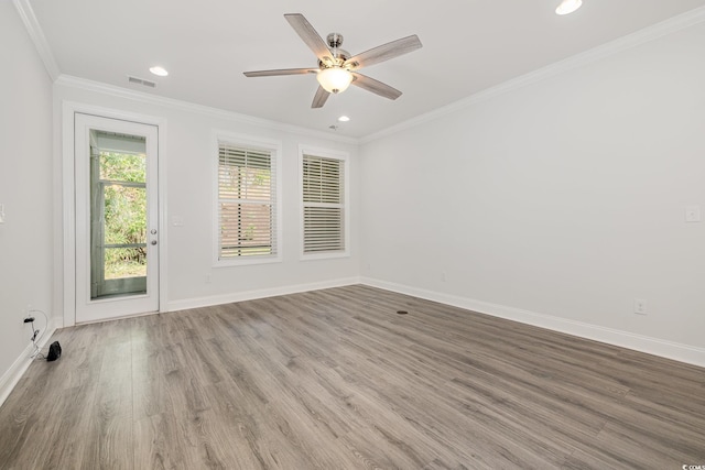 unfurnished room with wood finished floors, ornamental molding, baseboards, recessed lighting, and ceiling fan