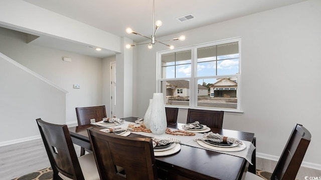 733 Choctaw Dr, Conway, SC 29526 - dining room with a chandelier, wood finished floors, and baseboards