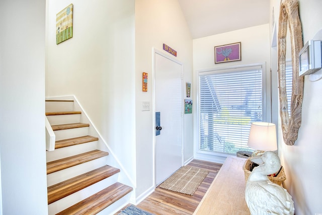 124 Spartina Ct Unit 30, Pawleys Island, SC 29585 - foyer entrance with wood finished floors, stairs, and vaulted ceiling