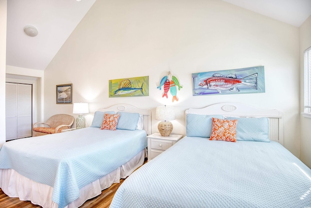 124 Spartina Ct Unit 30, Pawleys Island, SC 29585 - bedroom with lofted ceiling, wood finished floors, and a closet