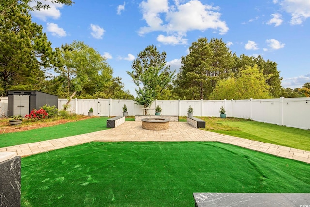 649 W Perry Rd, Myrtle Beach, SC 29579 - view of yard featuring a patio area, an outdoor fire pit, a shed, and an outbuilding
