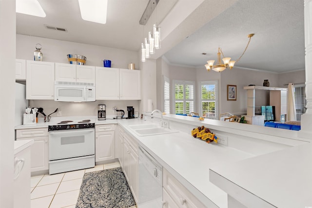 4429 Turtle Ln Unit 3A, Little River, SC 29566 - kitchen with a sink, white appliances, white cabinetry, and visible vents