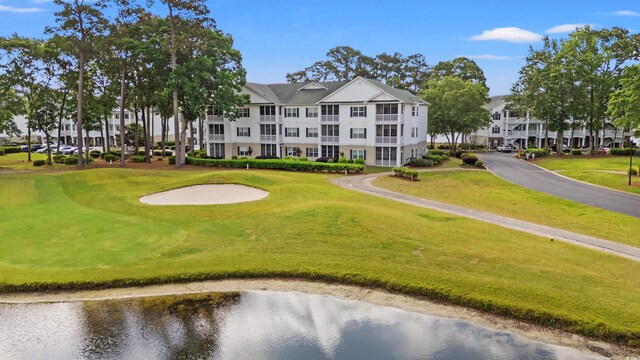 4429 Turtle Ln Unit 3A, Little River, SC 29566 - view of property's community with a water view, view of golf course, and a yard