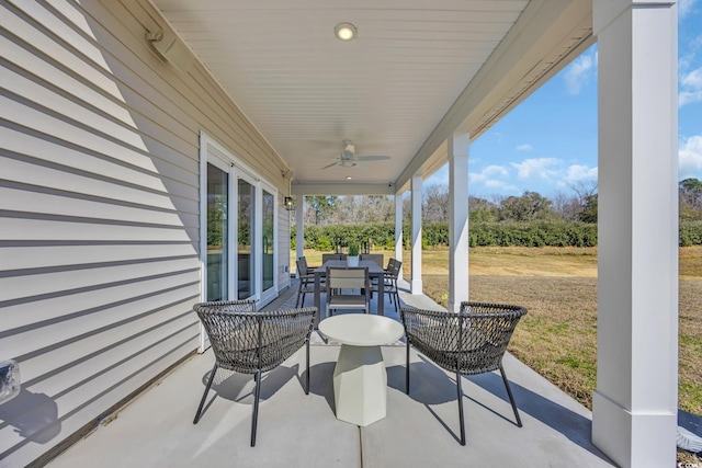 view of patio featuring outdoor dining area and ceiling fan