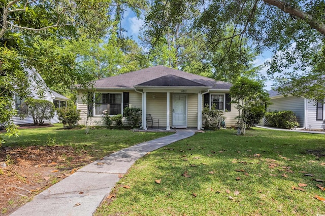 6612 Wintergreen Pt, Myrtle Beach, SC 29588 - bungalow-style house with a shingled roof and a front yard