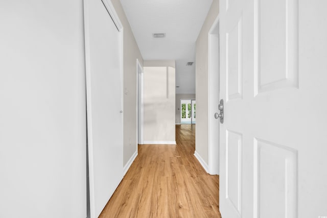 6612 Wintergreen Pt, Myrtle Beach, SC 29588 - hall with baseboards, light wood-style flooring, and visible vents