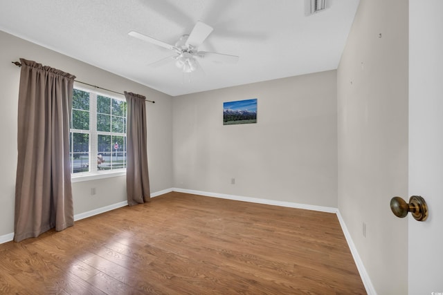 6612 Wintergreen Pt, Myrtle Beach, SC 29588 - empty room featuring baseboards, ceiling fan, visible vents, and wood finished floors