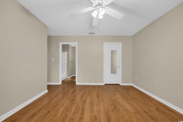 6612 Wintergreen Pt, Myrtle Beach, SC 29588 - spare room with a ceiling fan, wood finished floors, and baseboards