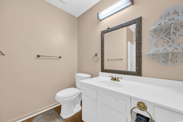 6612 Wintergreen Pt, Myrtle Beach, SC 29588 - bathroom with wood finished floors, toilet, vanity, and baseboards