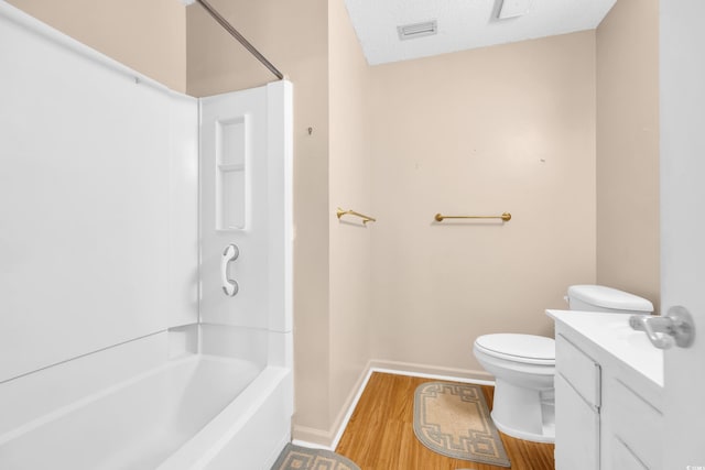 6612 Wintergreen Pt, Myrtle Beach, SC 29588 - bathroom featuring toilet, wood finished floors, washtub / shower combination, baseboards, and vanity