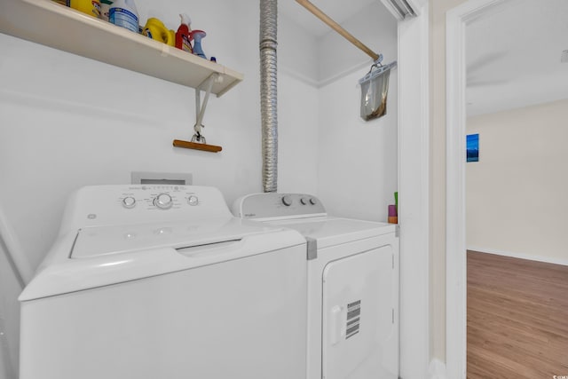 6612 Wintergreen Pt, Myrtle Beach, SC 29588 - washroom featuring washer and dryer and wood finished floors