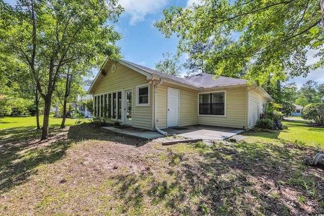 6612 Wintergreen Pt, Myrtle Beach, SC 29588 - back of property featuring a patio area and a lawn