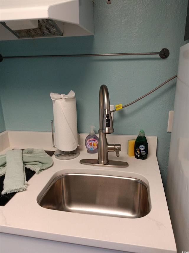2207 S Ocean Blvd Unit 1407, Myrtle Beach, SC 29577 - details with light countertops, exhaust hood, and a sink