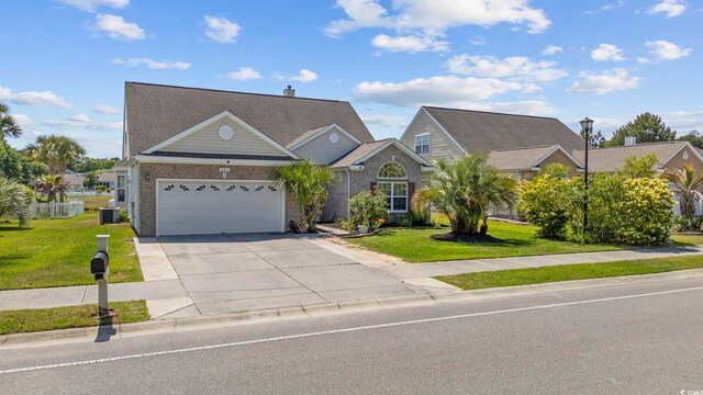 886 Carolina Farms Blvd, Myrtle Beach, SC 29579 - traditional-style house with concrete driveway, a front lawn, a garage, and central AC